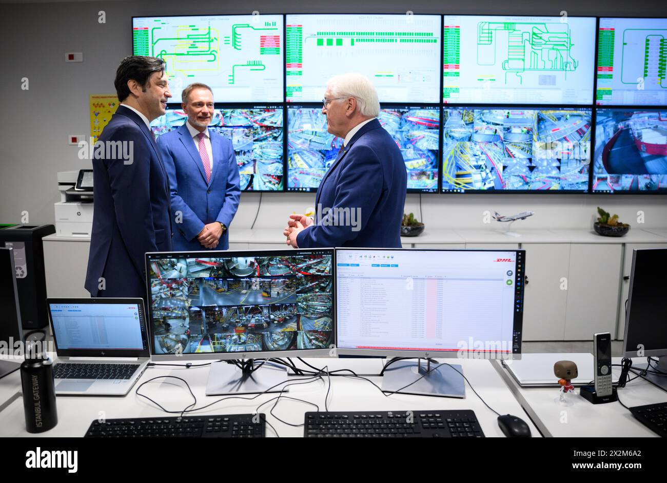 23 April 2024, Turkey, Istanbul: Federal President Frank-Walter Steinmeier (r) visits the DHL Express logistics center in Istanbul together with Christian Lindner (M, FDP), Federal Minister of Finance, and is given a tour of the logistics center by Volkan Demiroglu (l), Managing Director of DHL Express Turkey. Federal President Steinmeier is on a three-day official visit to Turkey. The occasion of the trip is the 100th anniversary of the establishment of diplomatic relations between Germany and Turkey. The Federal President is accompanied by representatives of the Federal Government, including Stock Photo