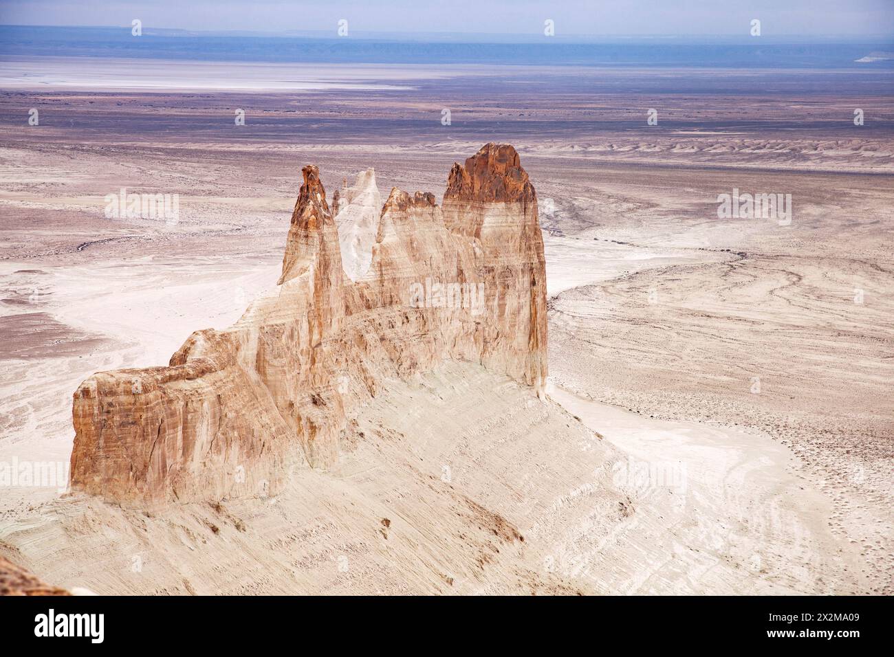 Bozzhyra tract in Kazakhstan, a scenic and arid desert landscape featuring dramatic rock formations and sediment layers. Stock Photo