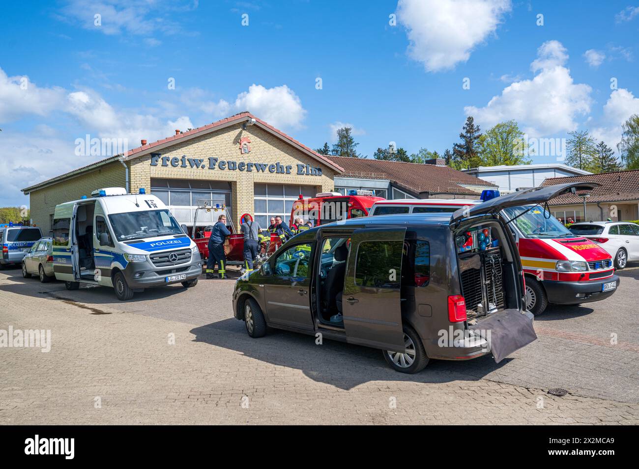 Lower Saxony, Germany. 23 April 2024, Lower Saxony, Bremervörde: Numerous emergency vehicles are parked in front of the volunteer fire department building. More than three hundred emergency services have been searching for a missing six-year-old child in Bremervörde, Lower Saxony, since Monday evening. As the police announced on Tuesday, the boy is autistic and does not respond to being spoken to. Credit: dpa picture alliance/Alamy Live News Stock Photo