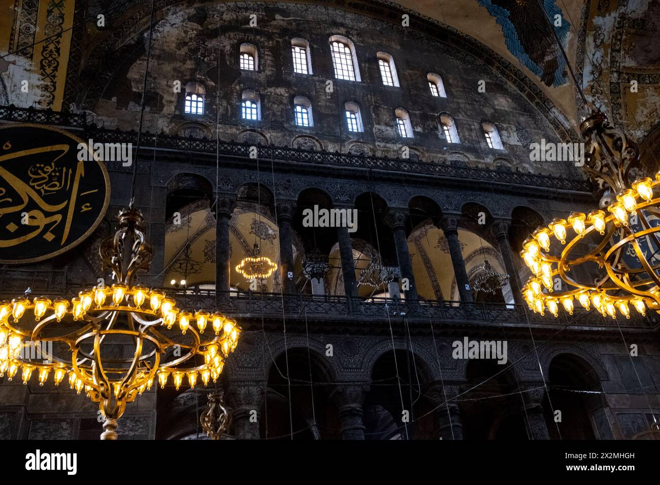 An imposing chandelier illuminates the interior of the Great Mosque of Saint Sophia, originally a Christian basilica and the most important monument o Stock Photo