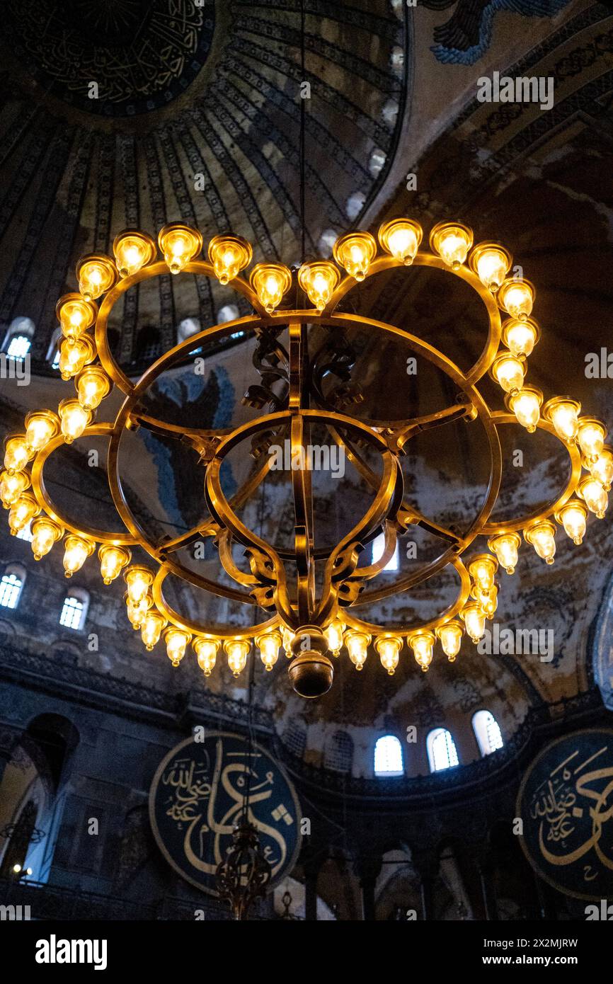 An imposing chandelier illuminates the interior of the Great Mosque of Saint Sophia, originally a Christian basilica and the most important monument o Stock Photo