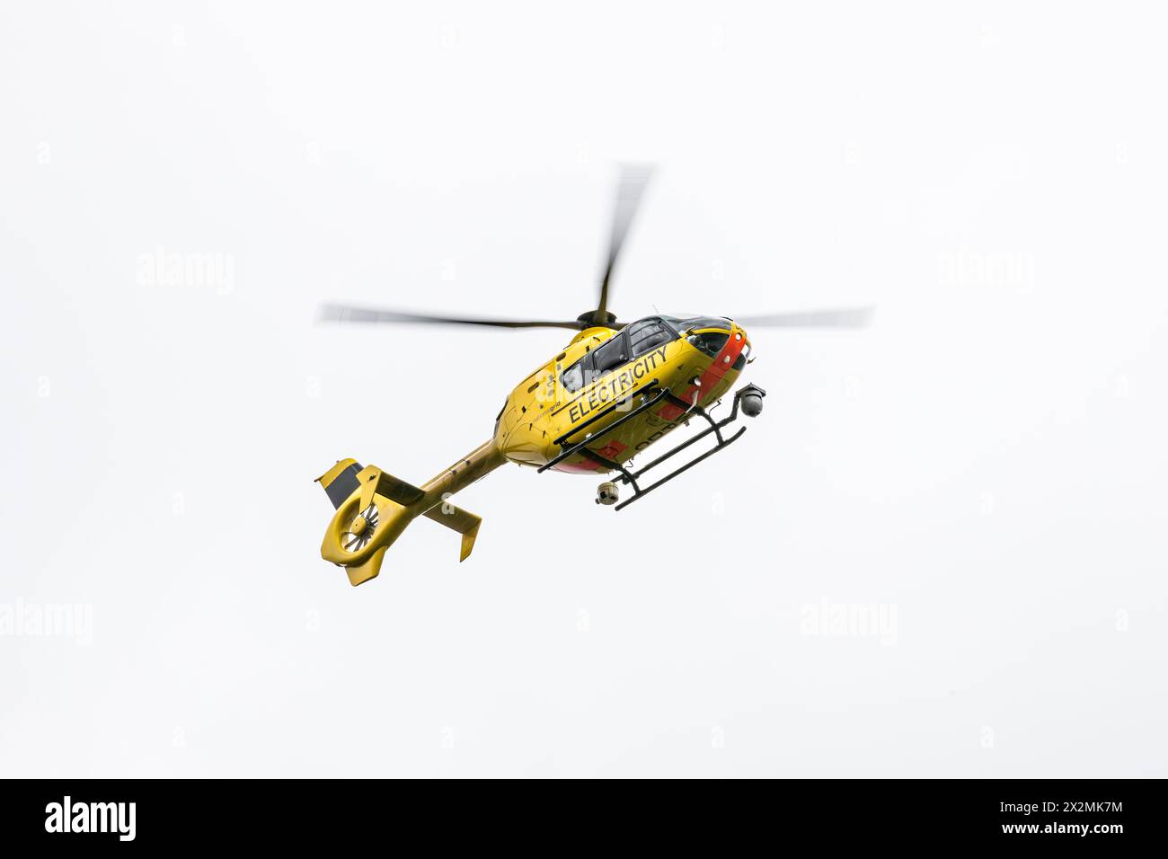 A National Grid EC-135 helicopter fitted with Trakkacam aerial surveillance cameras for monitoring power lines (UK) Stock Photo