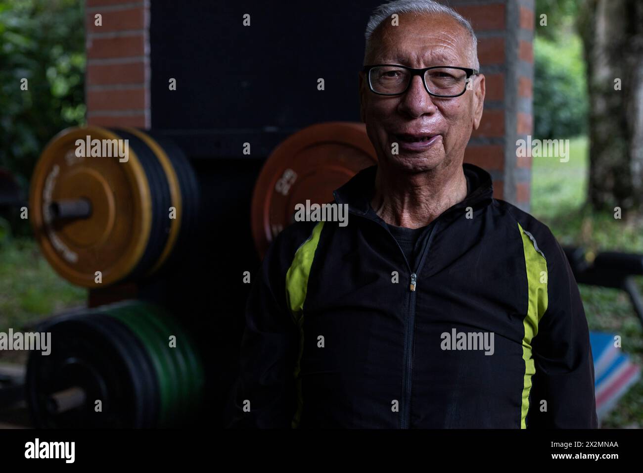 Portrait of Latin American senior male with positive attitude at the gym. Healthy lifestyle concept. Stock Photo