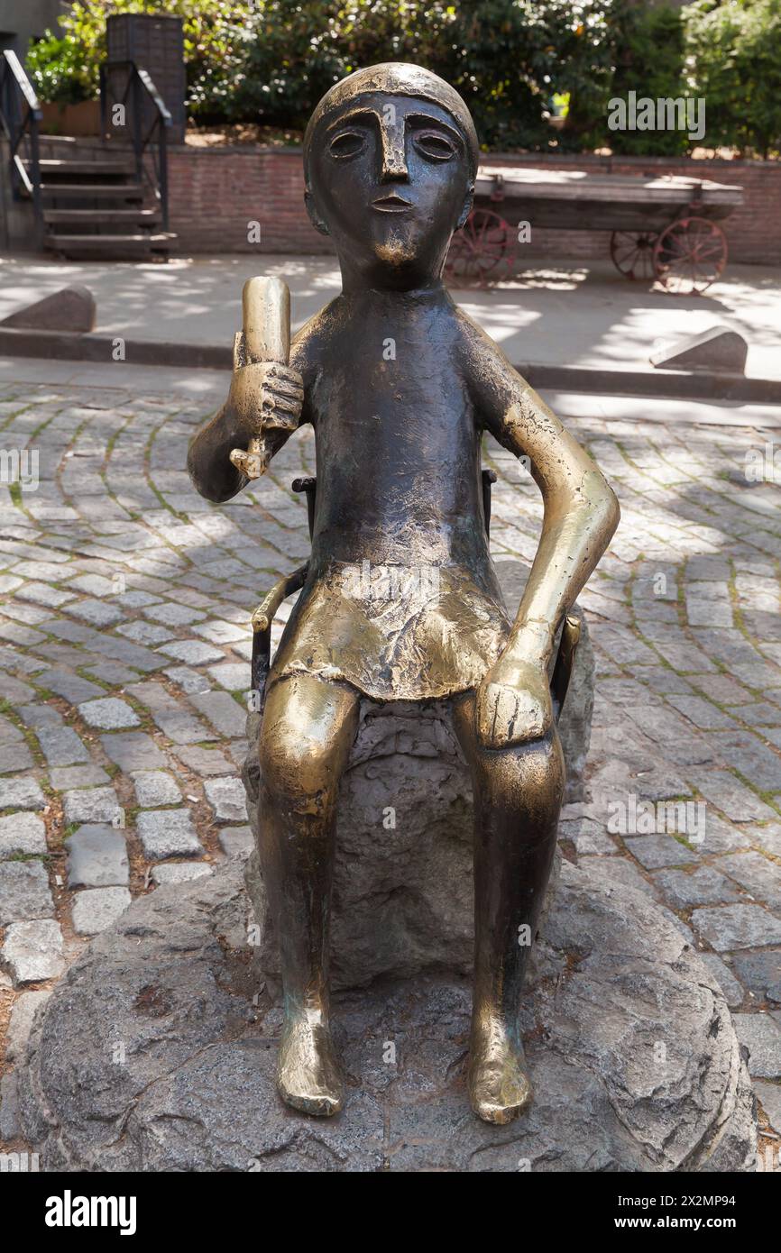 Tbilisi, Georgia - April 28, 2019: Monument to Toastmaster in the Old Town, on Sioni Street. It is an enlarged copy of a figurine found during excavat Stock Photo