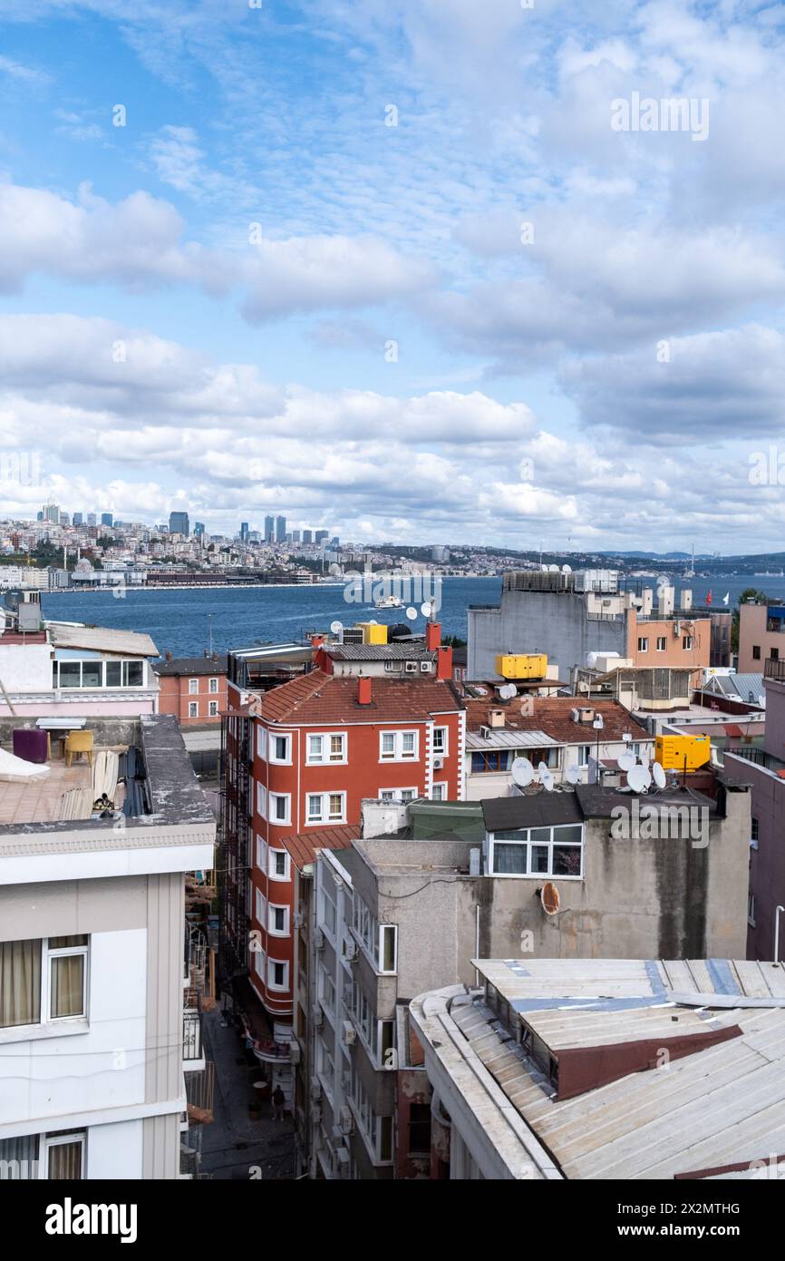 A cityscape with residential buildings, the Bosphorus strait and the 15th of July Martyrs Bridge in Istanbul, Turkey's largest city on the Bosphorus s Stock Photo