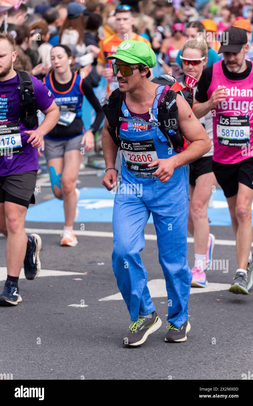 Matteo Bermond from Italy participating in the TCS London Marathon 2024 passing through Tower Hill, London, UK, as Luigi Stock Photo