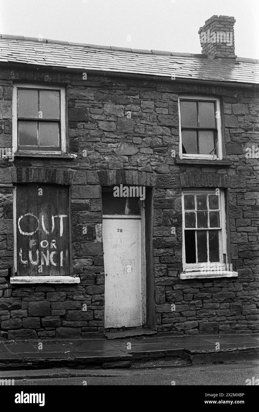 Humorous graffiti on a house awaiting demolition in Troedrhiwfuwch, South Wales, 1973. Stock Photo