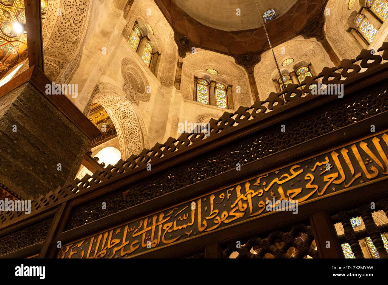 Cairo, Egypt - November 14 2023: Interior view of the highly decorated with arab scprpt of the islamic Complex and mosque of Sultan al-Mansur Qalawun Stock Photo
