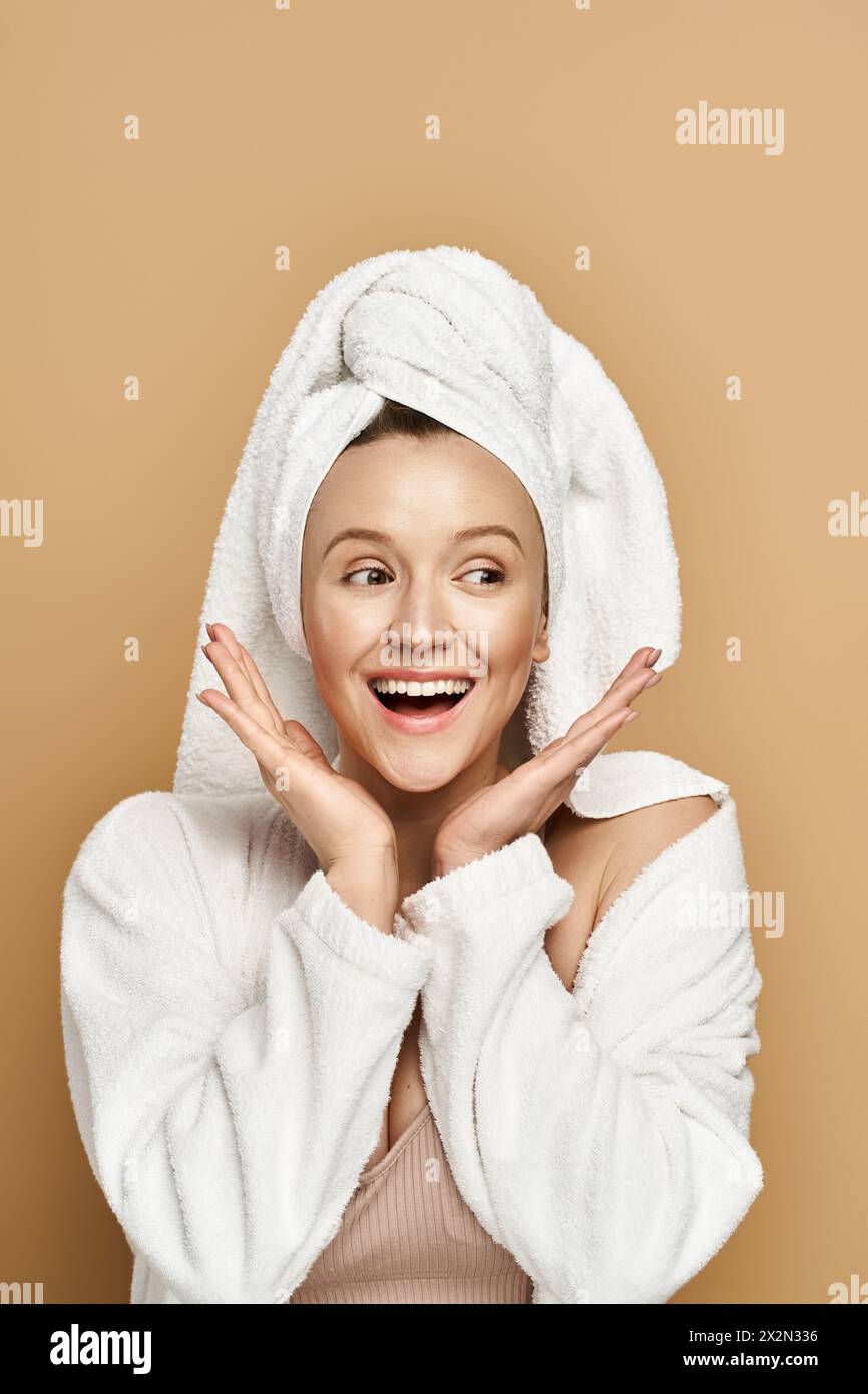 A stunning woman, radiating natural beauty, wears a towel on her head
