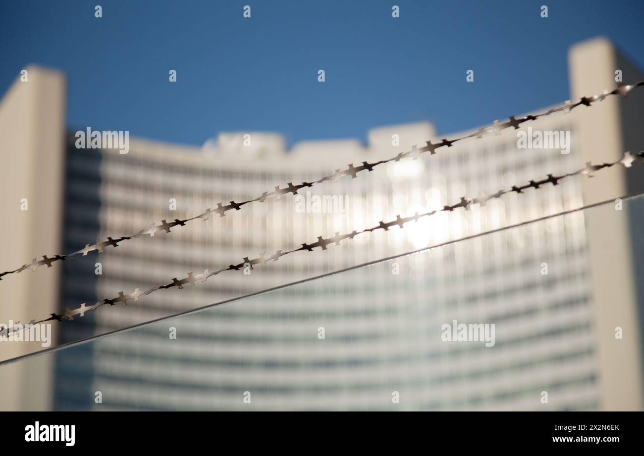 VIENNA- FEB 21: Barbed wire opposite UN building on FEB 21, 2012 in Vienna, Austria. The UN was established on 1 January 1980, and was the third such Stock Photo