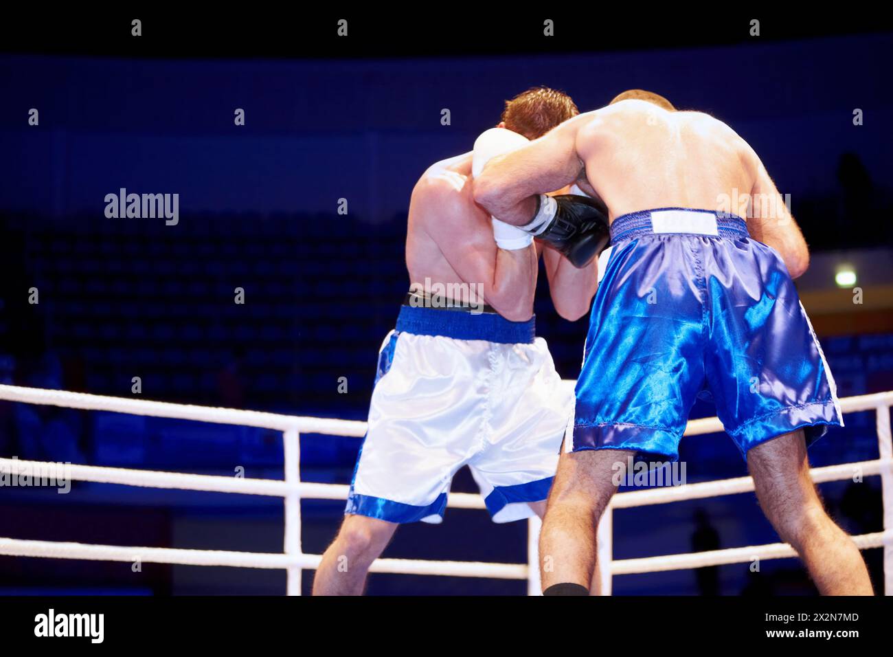 MOSCOW - JAN 13: Fight between participans during boxing match WSB in Moscow at Krylatskoye Sports Palace - Basket-Hall, Jan 13, 2012, Moscow, Russia. Stock Photo