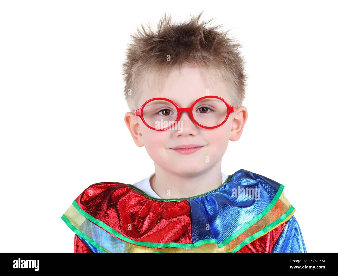 Cute little boy in big red glasses and clown costume isolated on white