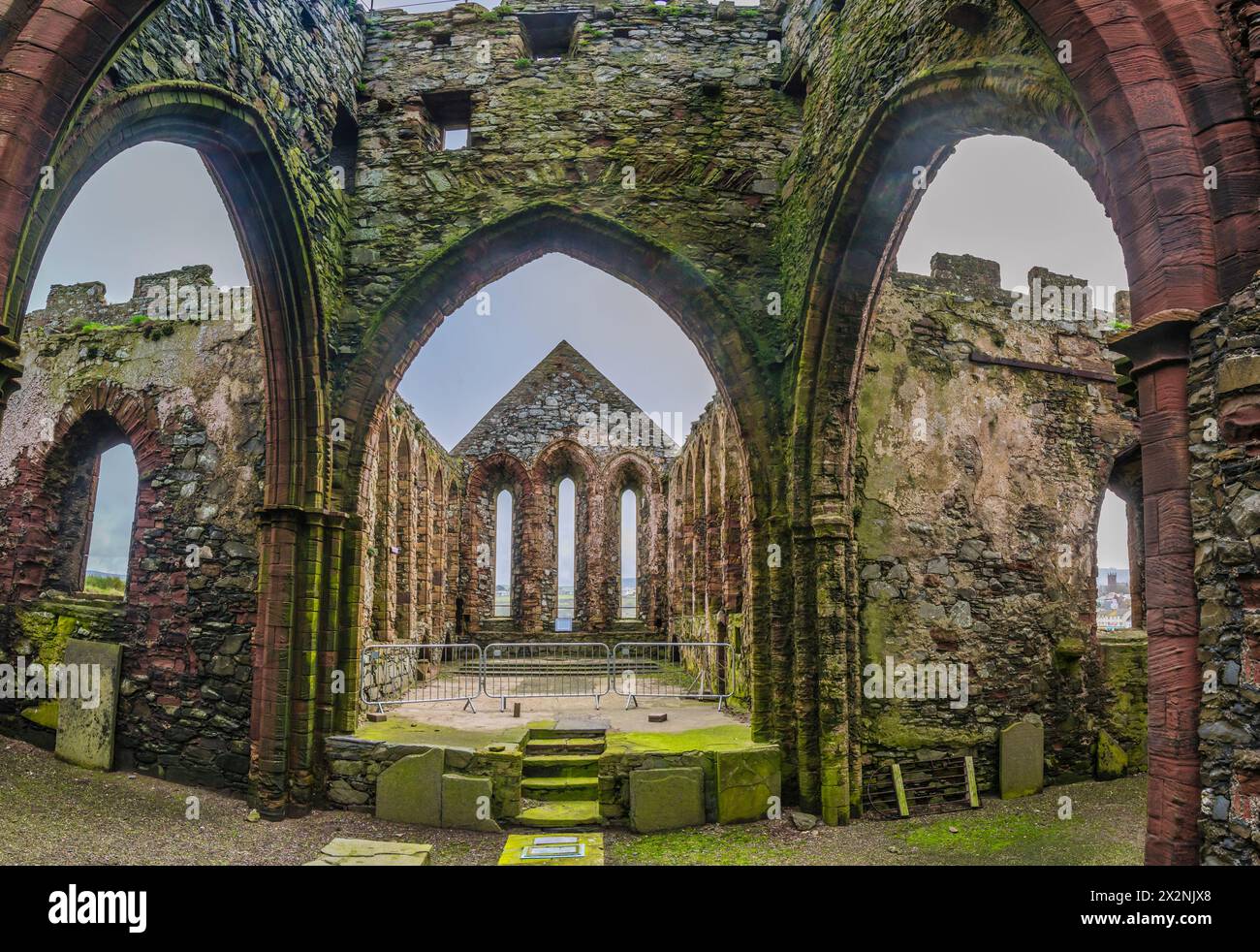 The image is of what was the interior of Peel Castle Abbey at the historic Peel Castle on the west coast of the Isle of Man. Stock Photo