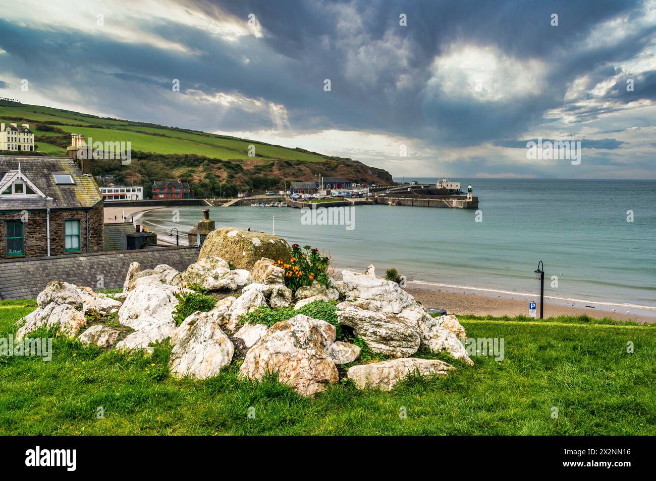 Scenic image looking across the bay towards the Raclan Pier and the Irish Sea at the coastal resort town of Port Erin on the Isle of Man Stock Photo