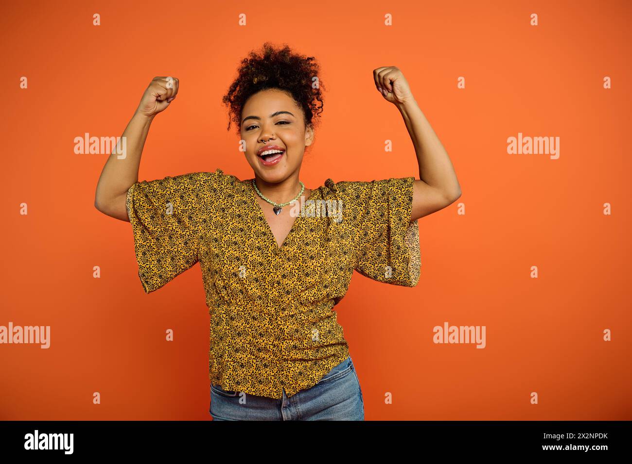 African american woman raising arms hi-res stock photography and images ...