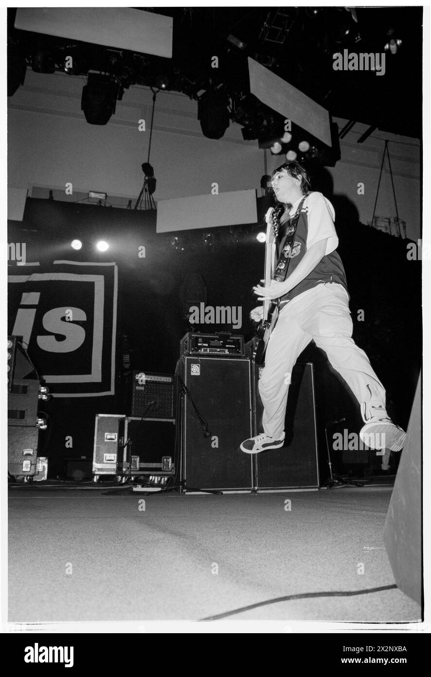 MANIC STREET PREACHERS, POST-RICHEY COMEBACK GIG, 1996: Nicky Wire of Welsh band Manic Street Preachers playing as support to Oasis at Cardiff International Arena, Wales, UK on 19 March 1996. Photo: Rob Watkins.  INFO: This concert was the Welsh band Manic Street Preachers return to touring as support to Oasis after the disappearance one year earlier of their lyricist Richey Edwards. They unveiled songs like 'Design For Life' from their iconic 'Everything Must Go' album on this tour. Stock Photo