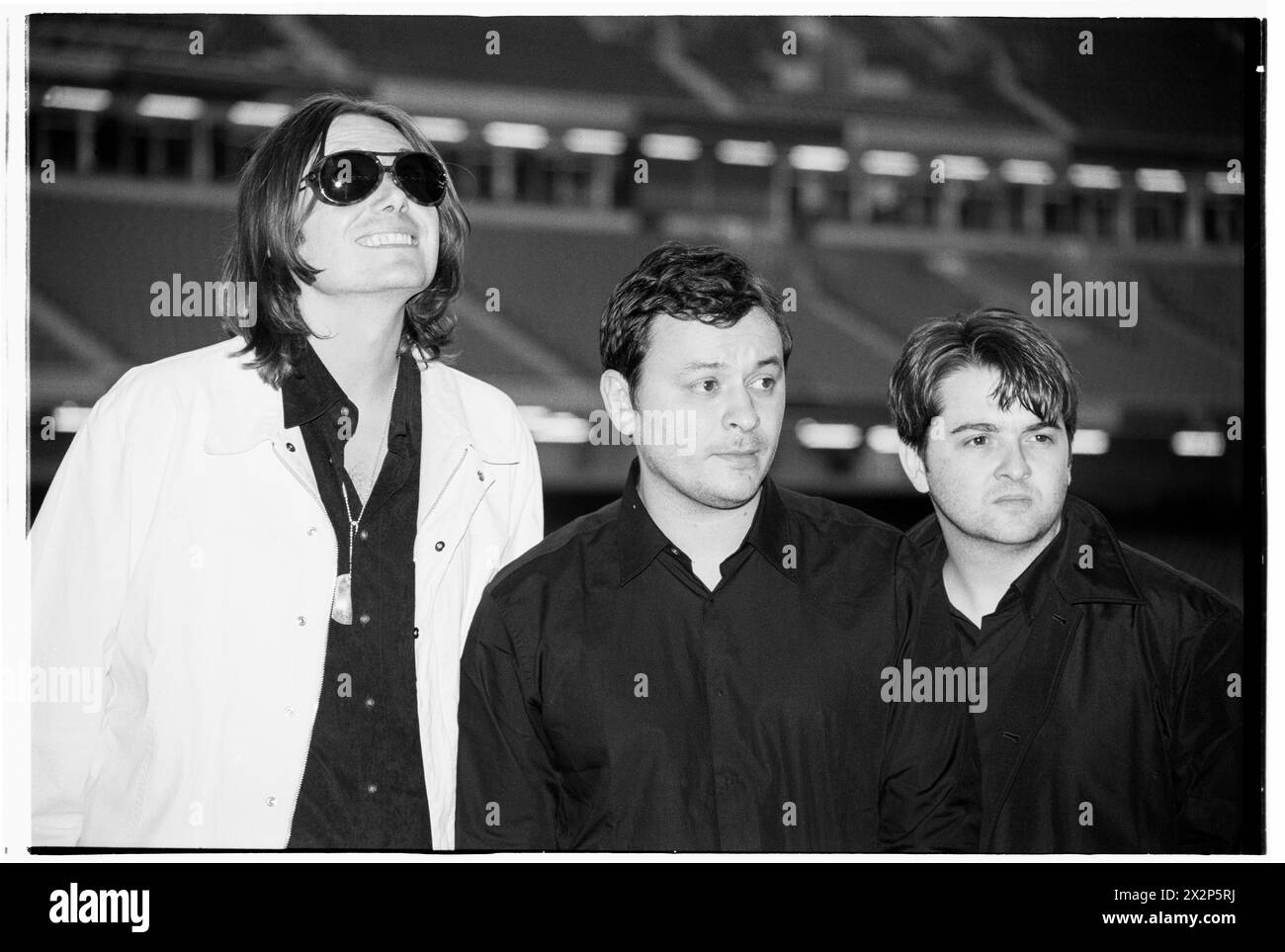 MANIC STREET PREACHERS, PRESS CONFERENCE, 1999: James Dean Bradfield, Nicky Wire and Sean Moore of Welsh band Manic Street Preachers at a Press Conference at Millennium Stadium, Cardiff Wales, UK on 1 November 1999. The band were promoting their millennium night gig in front of more than 57,000 fans on New Year's Eve 1999–2000 at the Millennium Stadium in Cardiff, called 'Leaving The 20th Century'. Photo: Rob Watkins. INFO: Manic Street Preachers, a Welsh rock band formed in 1986, emerged as icons of the '90s British music scene. Known for their politically charged lyrics and anthemic melodies Stock Photo