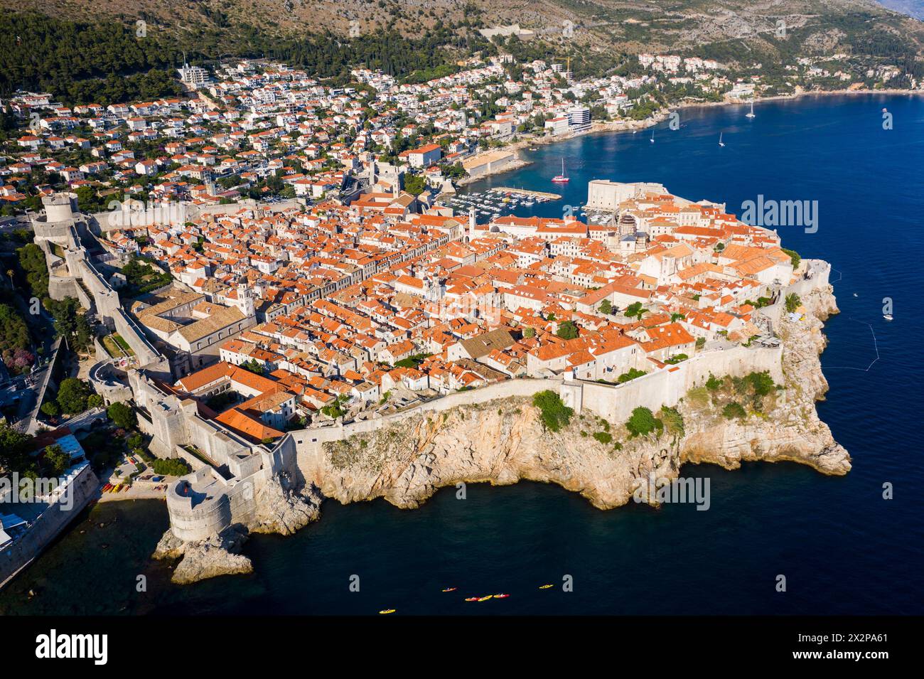 Dubrovnik, Croatia: Aerial of the famous Dubrovnik medieval old town and harbor with its fortified walls and tower by the Adriatic sea in Croatia on a Stock Photo