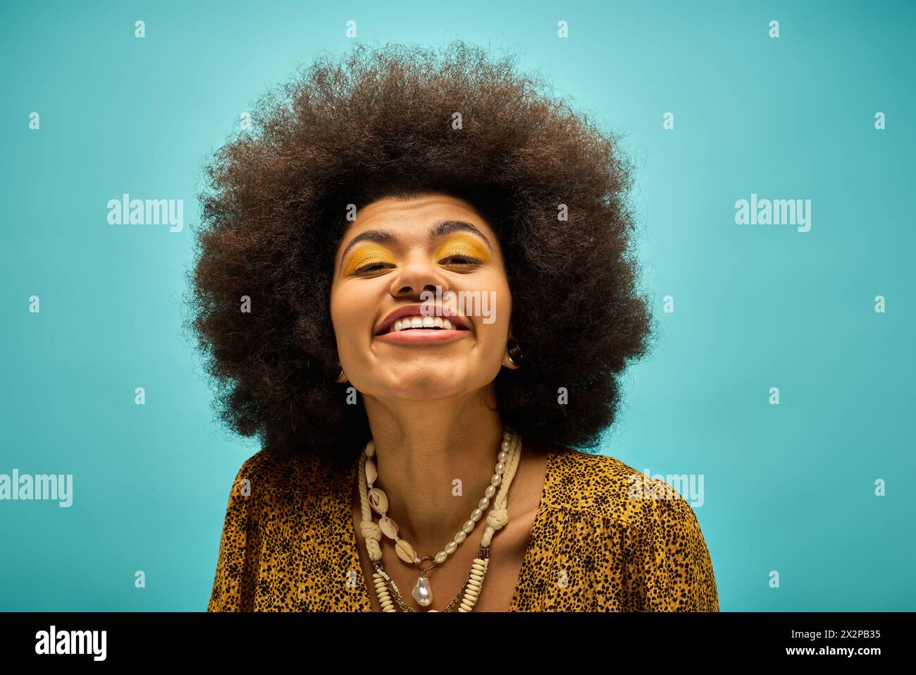 A stylish African American woman in trendy attire, with a beaming smile ...