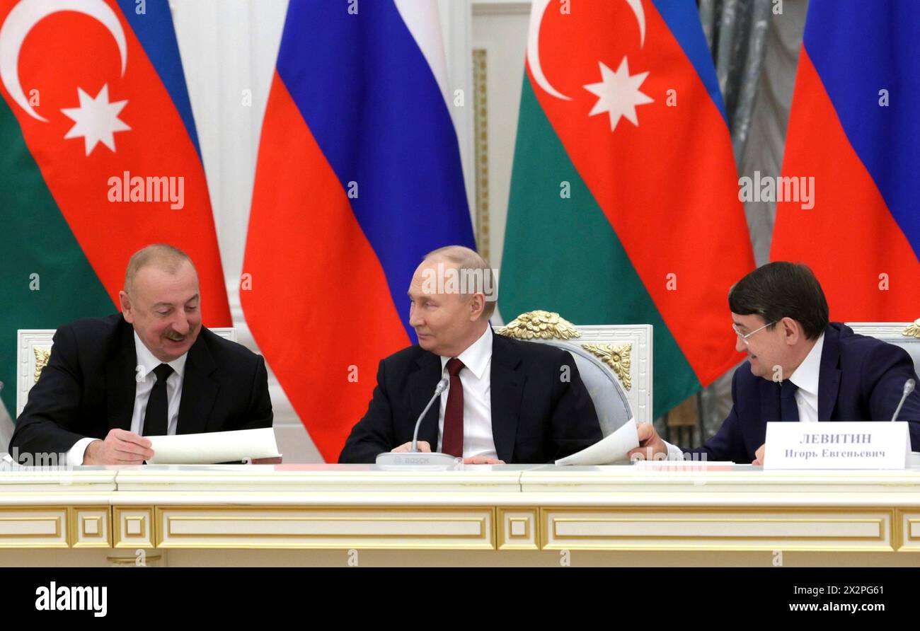Moscow, Russia. 22nd Apr, 2024. Russian President Vladimir Putin, center, chats with Azerbaijan President Ilham Aliyev, left, and Presidential Aide Igor Levitin, right, during a meeting with veteran builders and workers of the Baikal-Amur railway line to mark the 50th anniversary of the construction start at the Kremlin Grand Palace, April 22, 2024, in Moscow, Russia. Credit: Gavriil Grigorov/Kremlin Pool/Alamy Live News Stock Photo