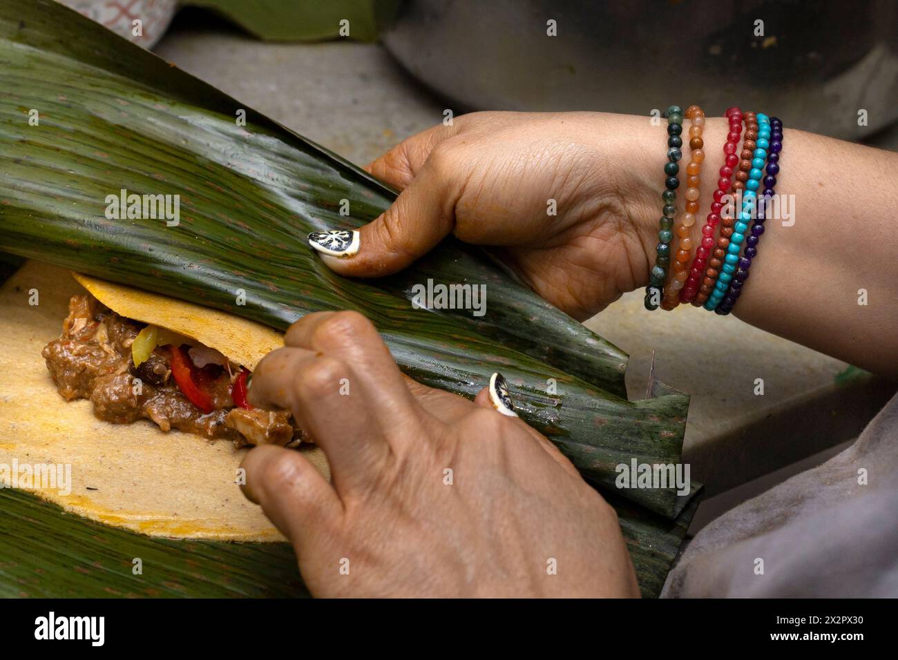 Hallaca Threading Preparation and ingredients of a Hallaca or tamale wrapped in banana ...