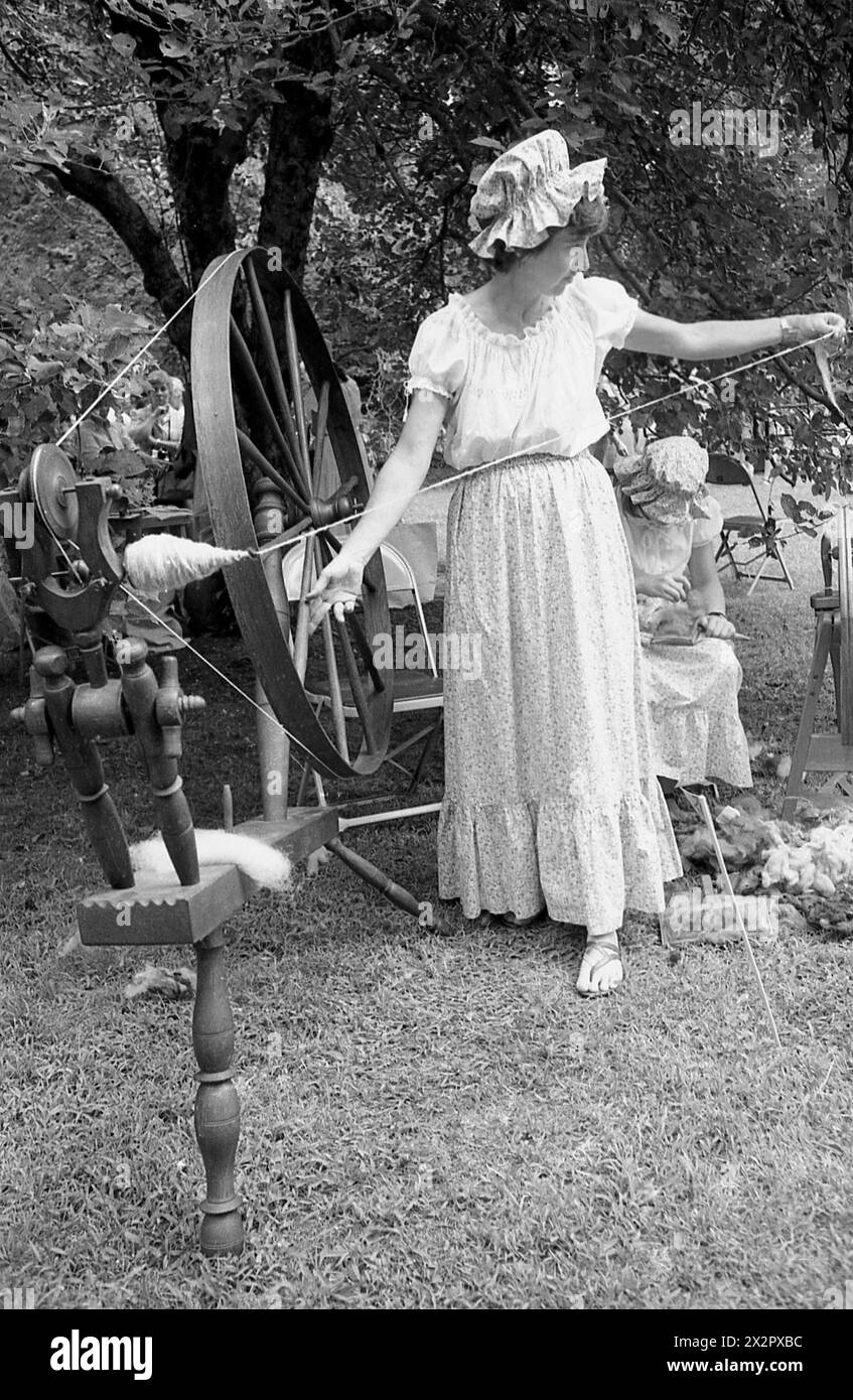 Connecticut, U.S.A., 1982. Woman using a spinning wheel; historical