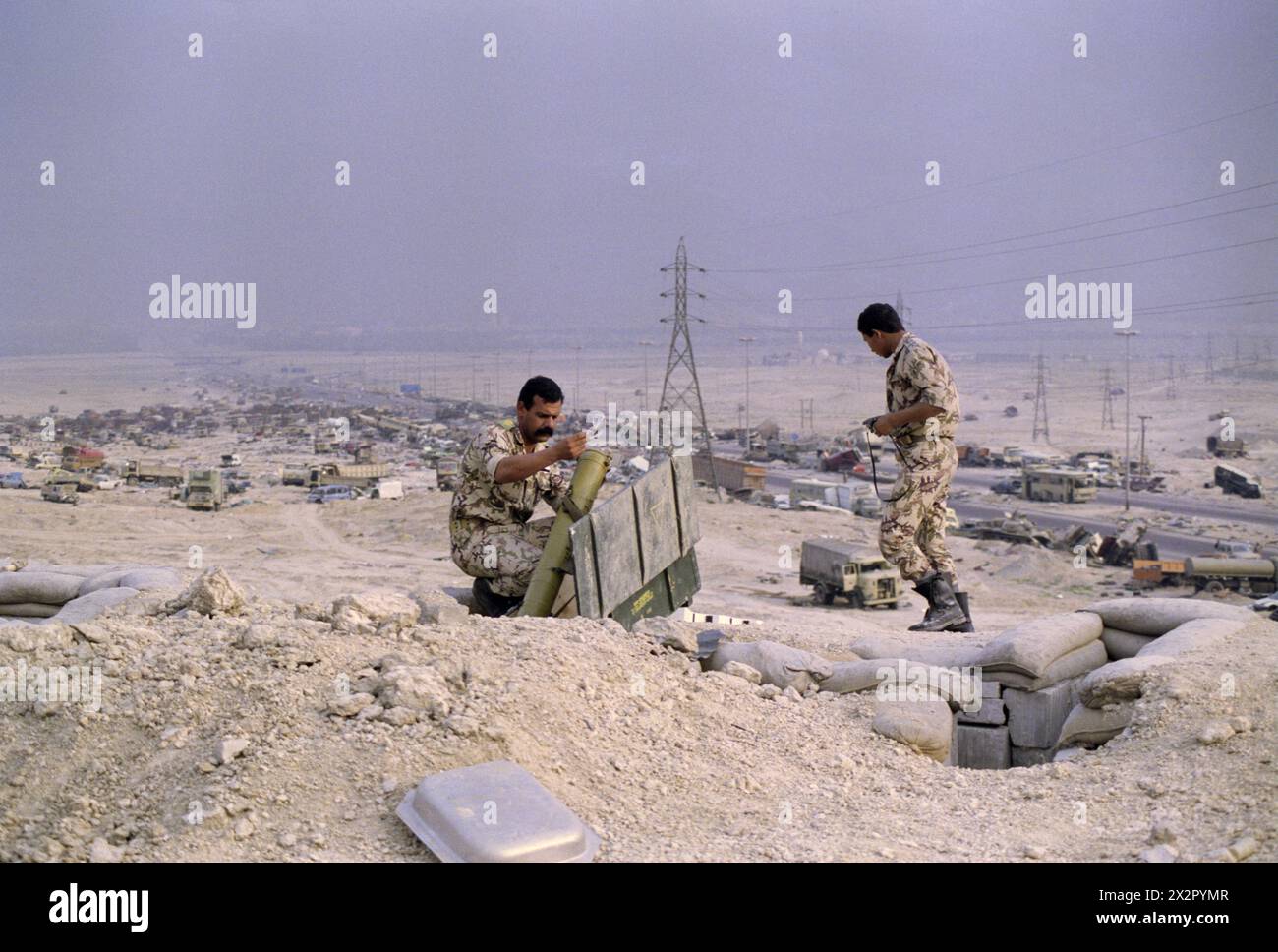 1st April 1991 Saudi Arabian soldiers examine abandoned Iraqi weapons in a bunker on the Mutla Ridge above the 'Highway of Death', north of Kuwait City. Stock Photo