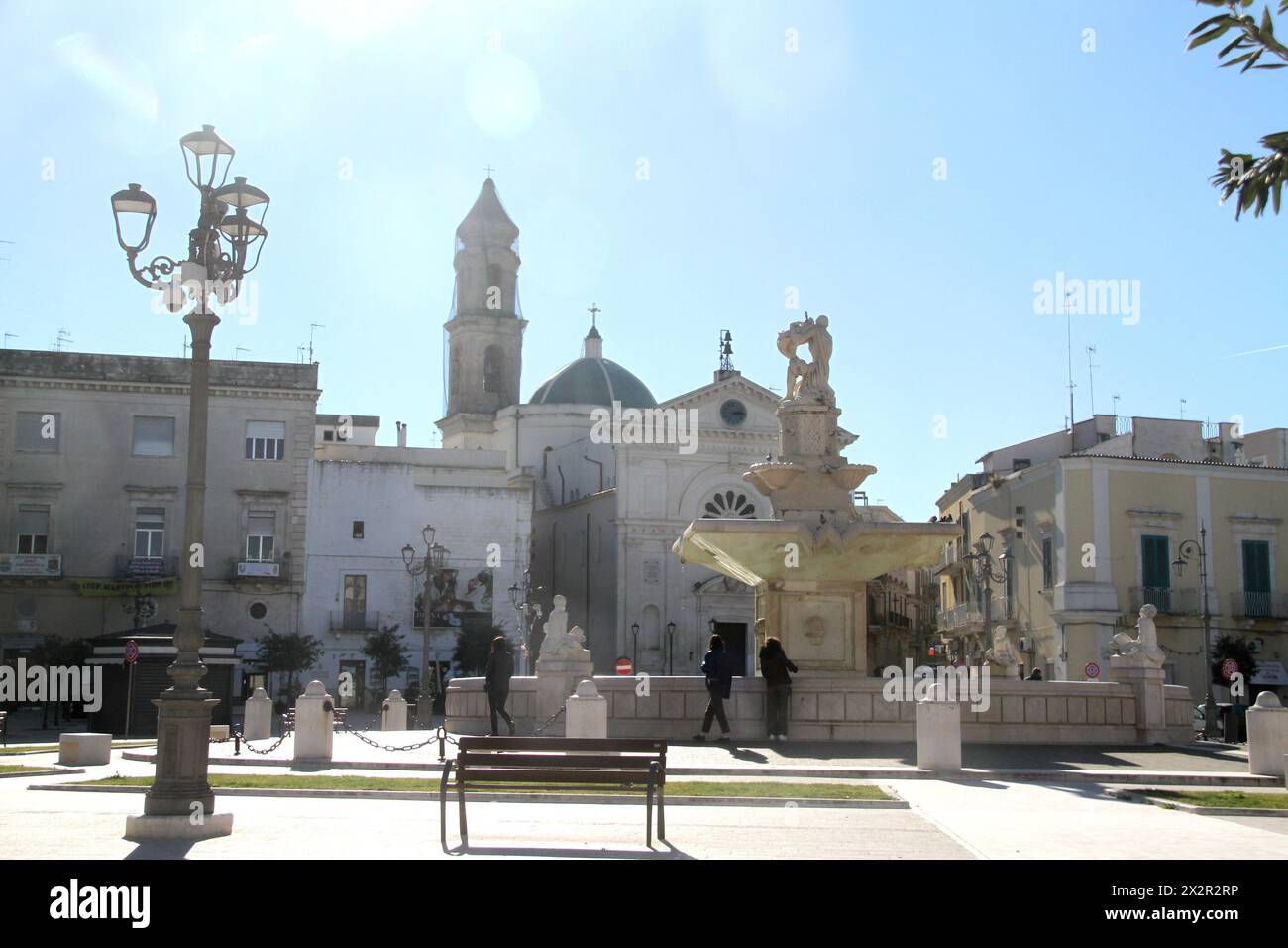 Mola di Bari, Italy. View of Piazza XX Settembre, with the fountain-monument in the center. Stock Photo