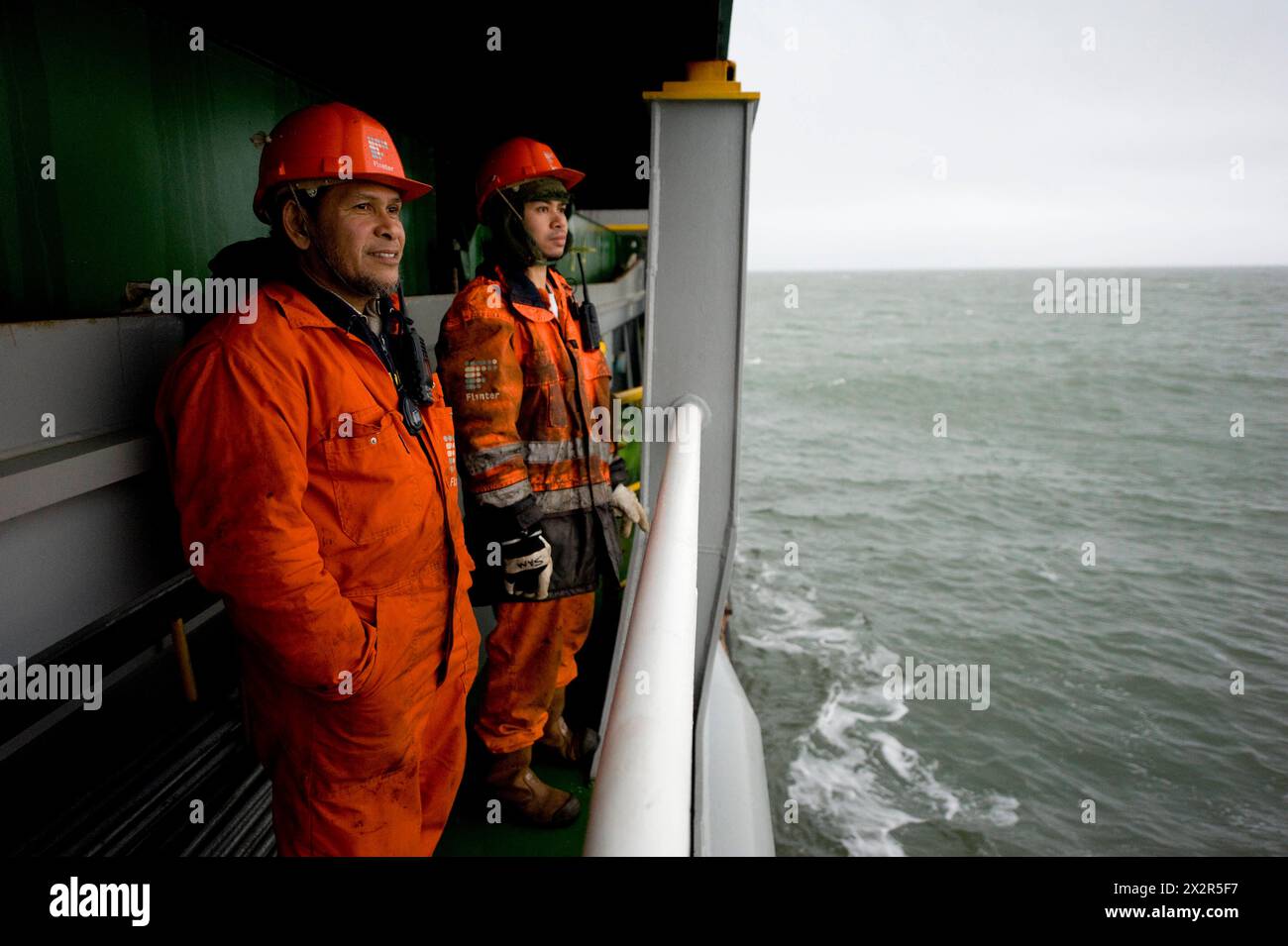 Two Able Seamen on Deck Two Able Seamen on Deck, waiting for the Pilot to guide containerevessel MS Flintercape into the harbour of Stockholm, Sweden. Rotterdam NLD - Sundsvall SE Containervessel MS Flintercape Noordzee, Baltische Zee, Golf va Netherlands Copyright: xGuidoxKoppesxPhotox Stock Photo