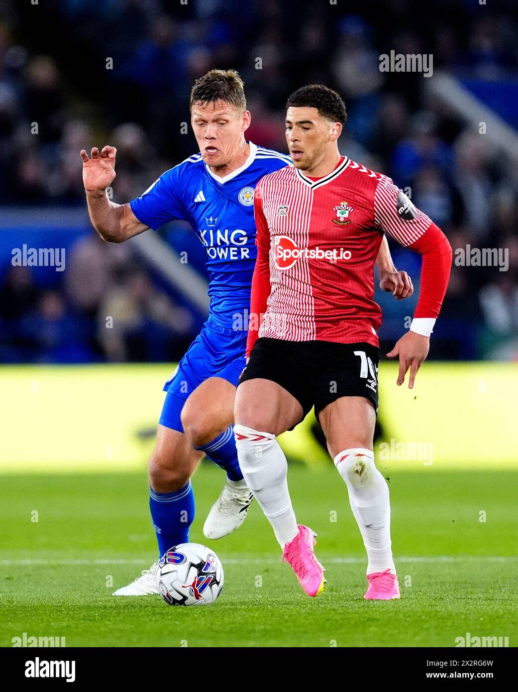 Leicester City's Jannik Vestergaard (left) and Southampton's Che Adams battle for the ball during the Sky Bet Championship match at the King Power Stadium, Leicester. Picture date: Tuesday April 23, 2024. Stock Photo