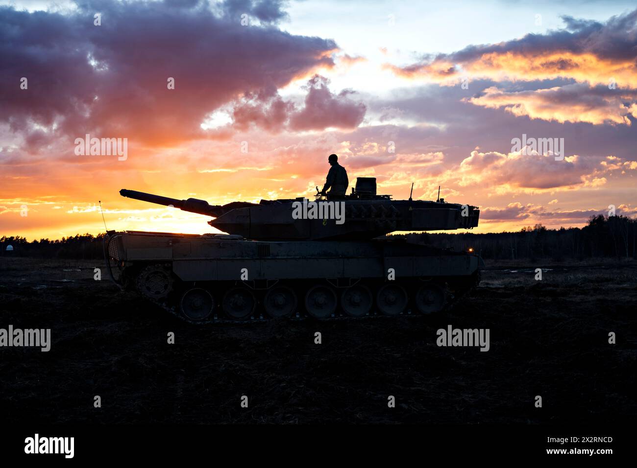 Drawsko Pomorskie, Poland. 24 February, 2024. A Polish Army Leopard 2A5 main battle tank with the Warszawska Brygada is silhouetted by the rising sun during exercise Steadfast Defender 24 at the Drawsko Training Ground, February 24, 2024, in Drawsko Pomorskie, Poland.  Credit: SFC Kyle Larsen/US Army Photo/Alamy Live News Stock Photo