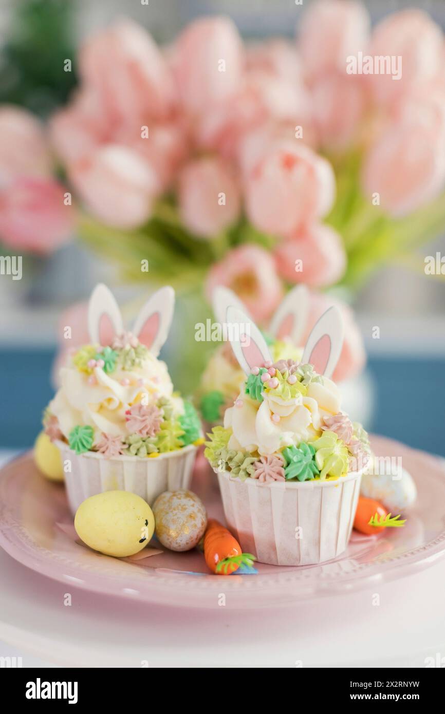 Decorated Easter cupcakes in plate Stock Photo