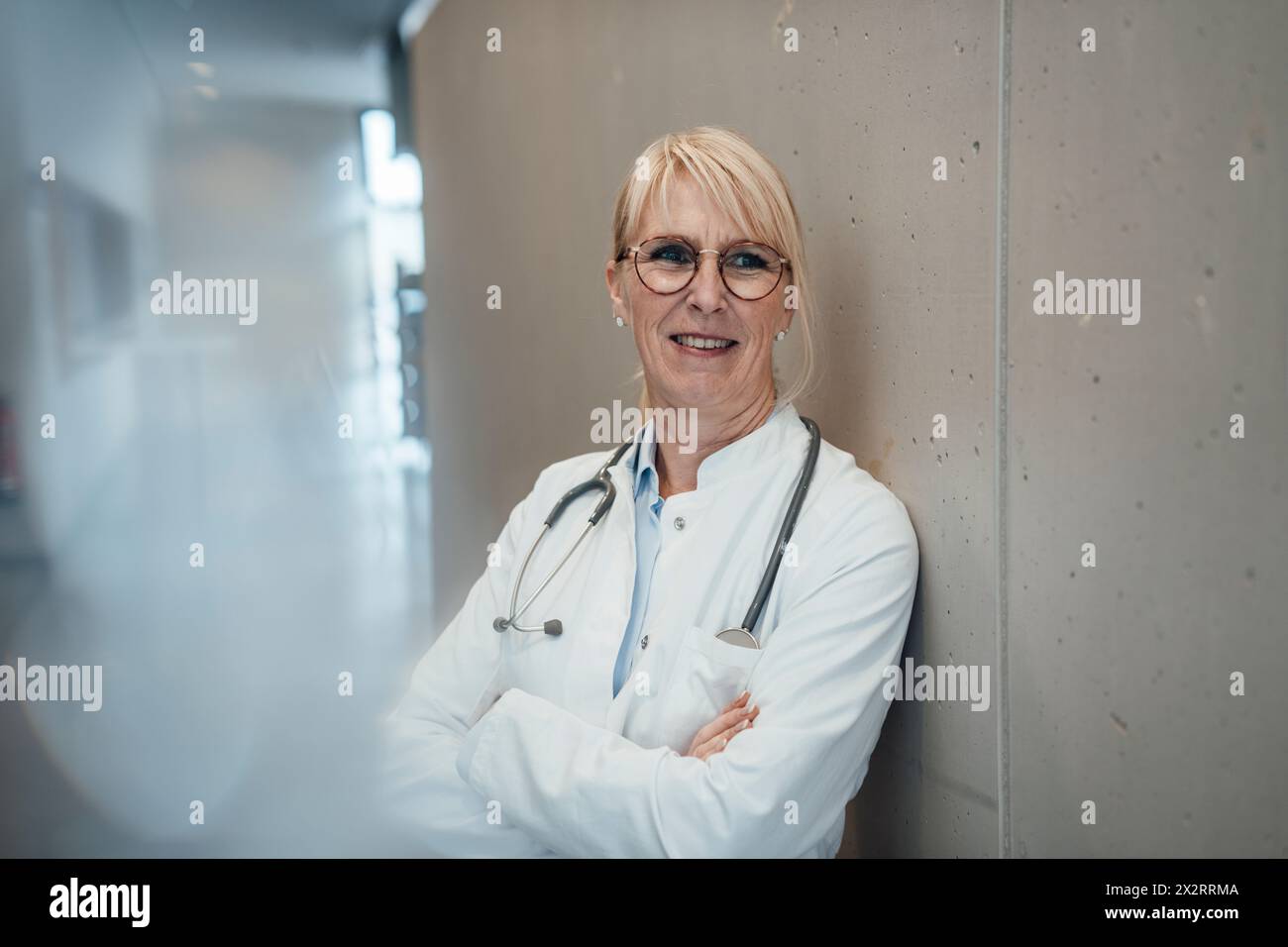 Smiling mature woman doctor hi-res stock photography and images - Alamy