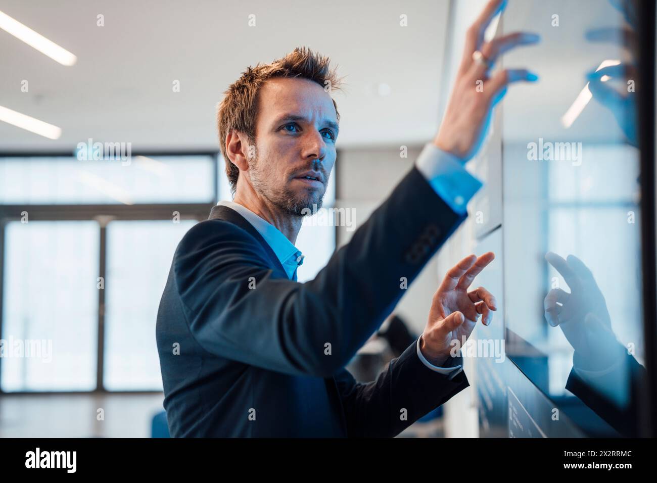 Businessman working on computer in office Stock Photo