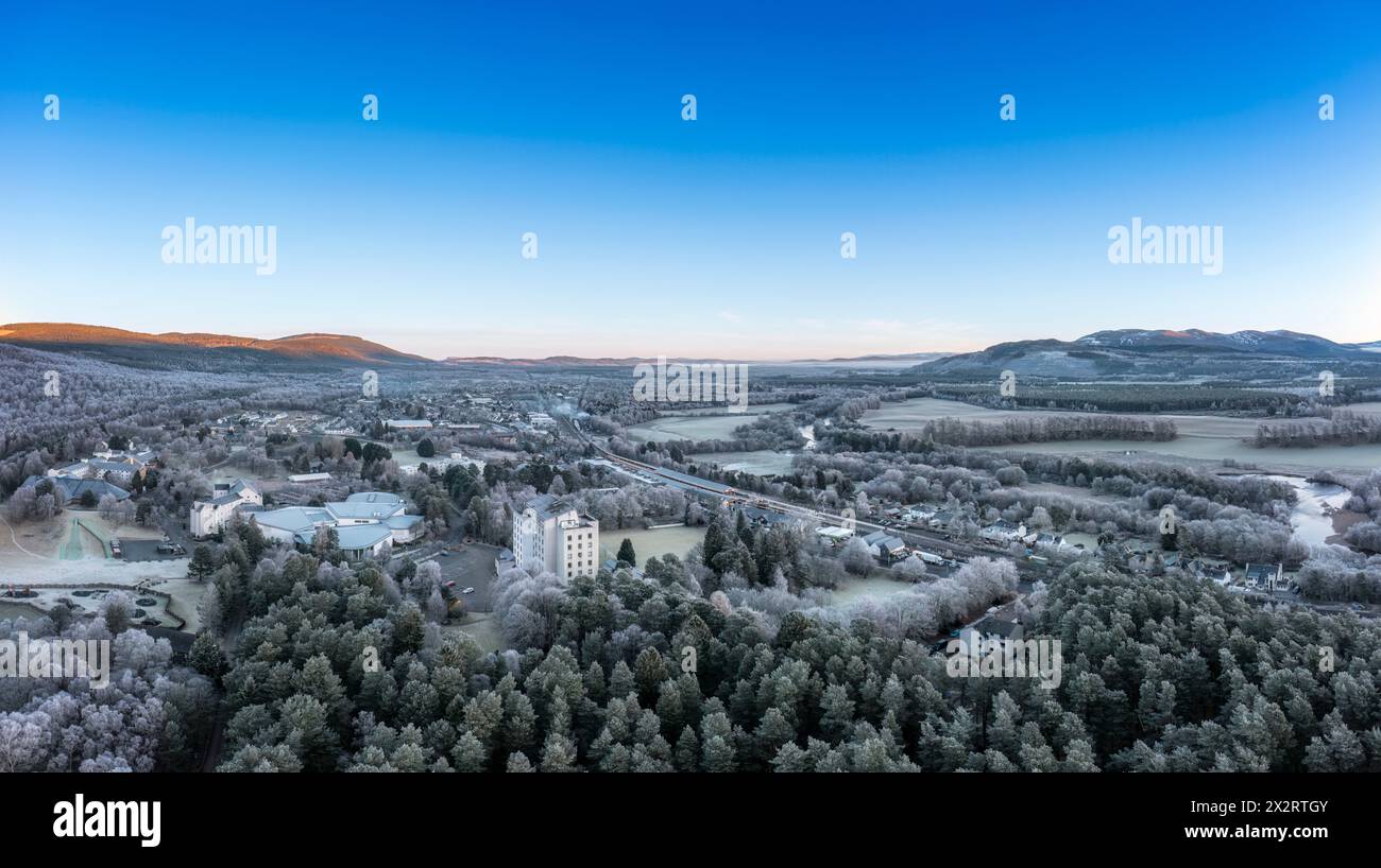 UK, Scotland, Aviemore, Aerial panorama of Aviemore Resort and surrounding landscape in winter Stock Photo