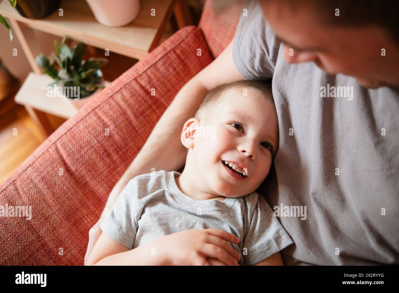 Father and son spending leisure time at home Stock Photo