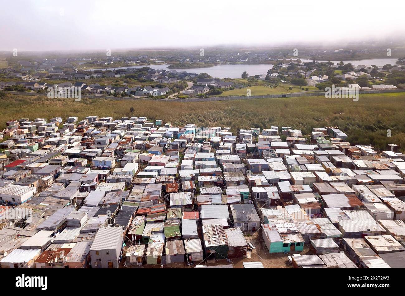 Aerial of township and wealthy houses in divided South Africa Stock Photo