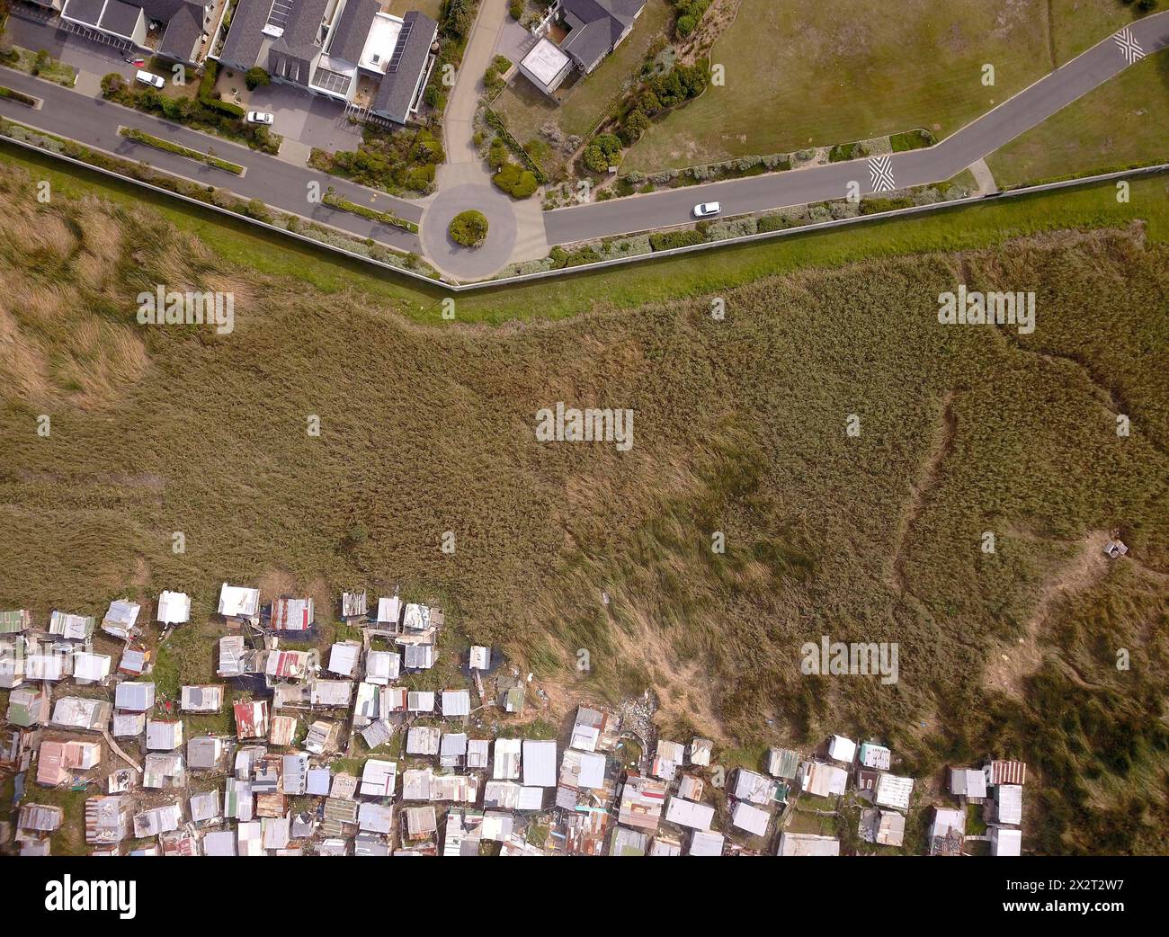 Aerial of township and wealthy houses in divided South Africa Stock Photo