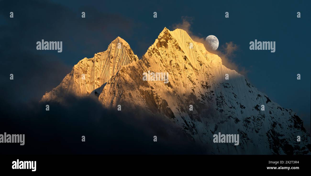 Nepal, Khumbu, Moon rising over Thamserku and Kangtega mountains Stock Photo