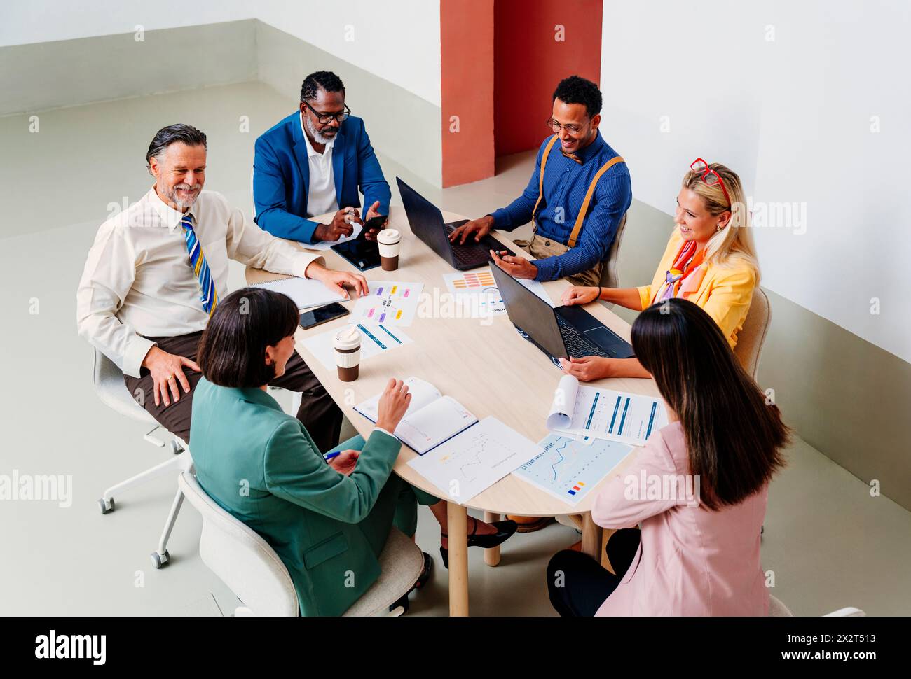 Multi-ethnic business corporate discussing at desk in office Stock Photo
