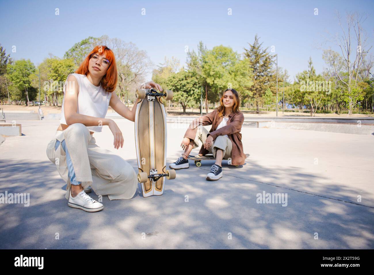 Young skaters posing together at skateboard park Stock Photo