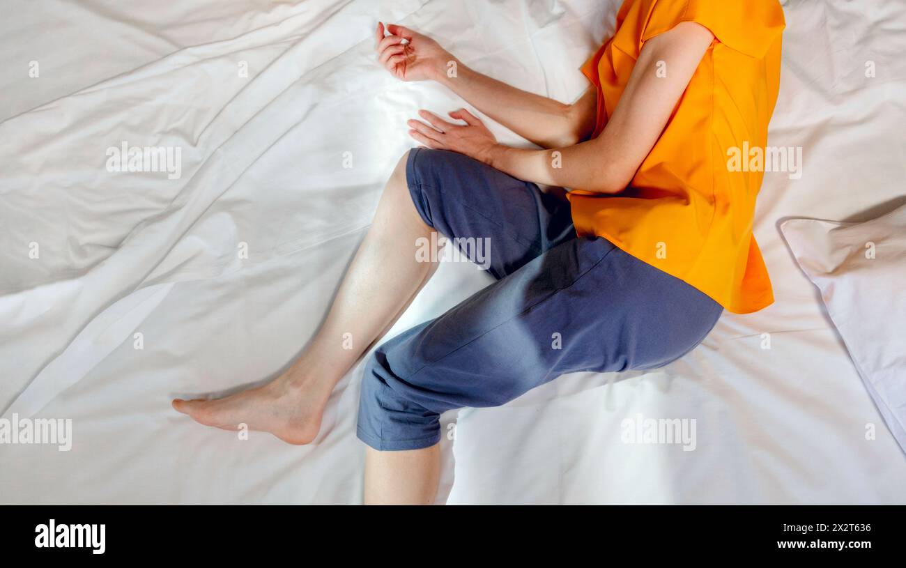 Woman sleeping on bed at home Stock Photo