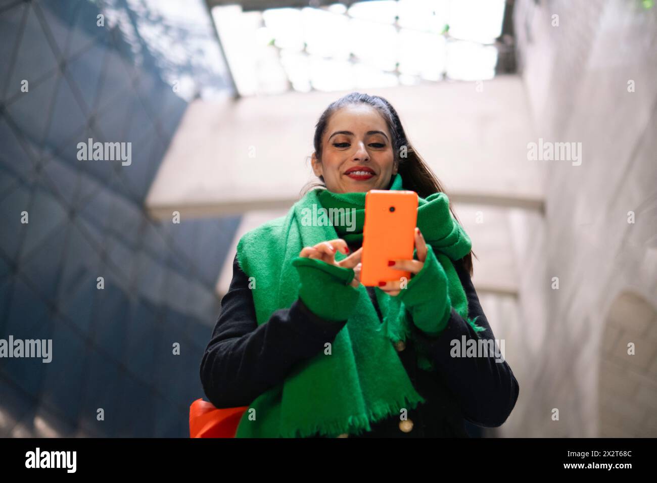 Happy woman using smart phone Stock Photo