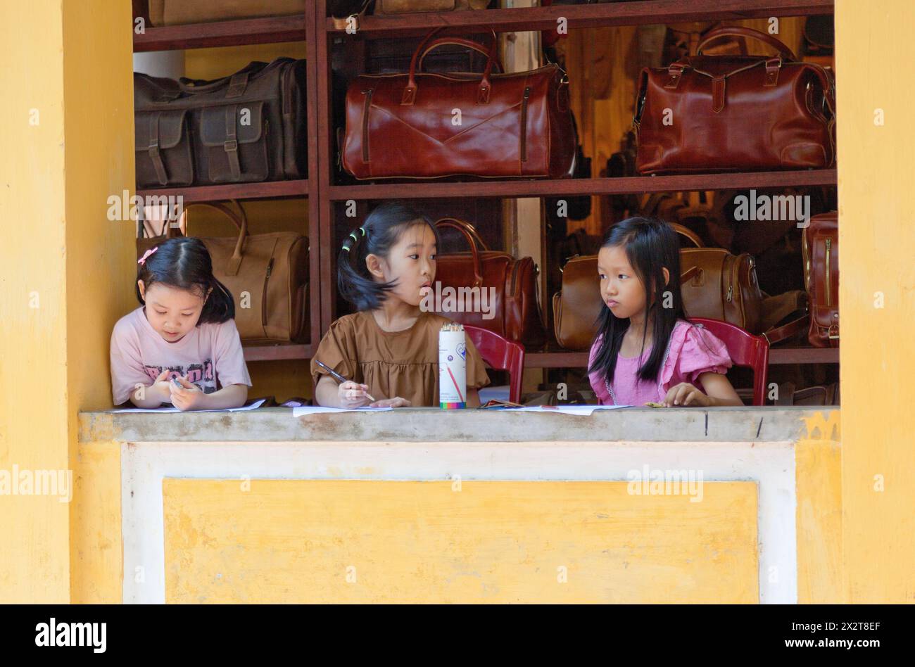 Vietnamese school children,, drawing, school work at home Stock Photo