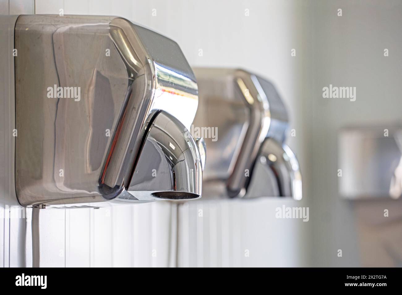 modern hand dryer in the toilet room. Modern Design Trends Stock Photo