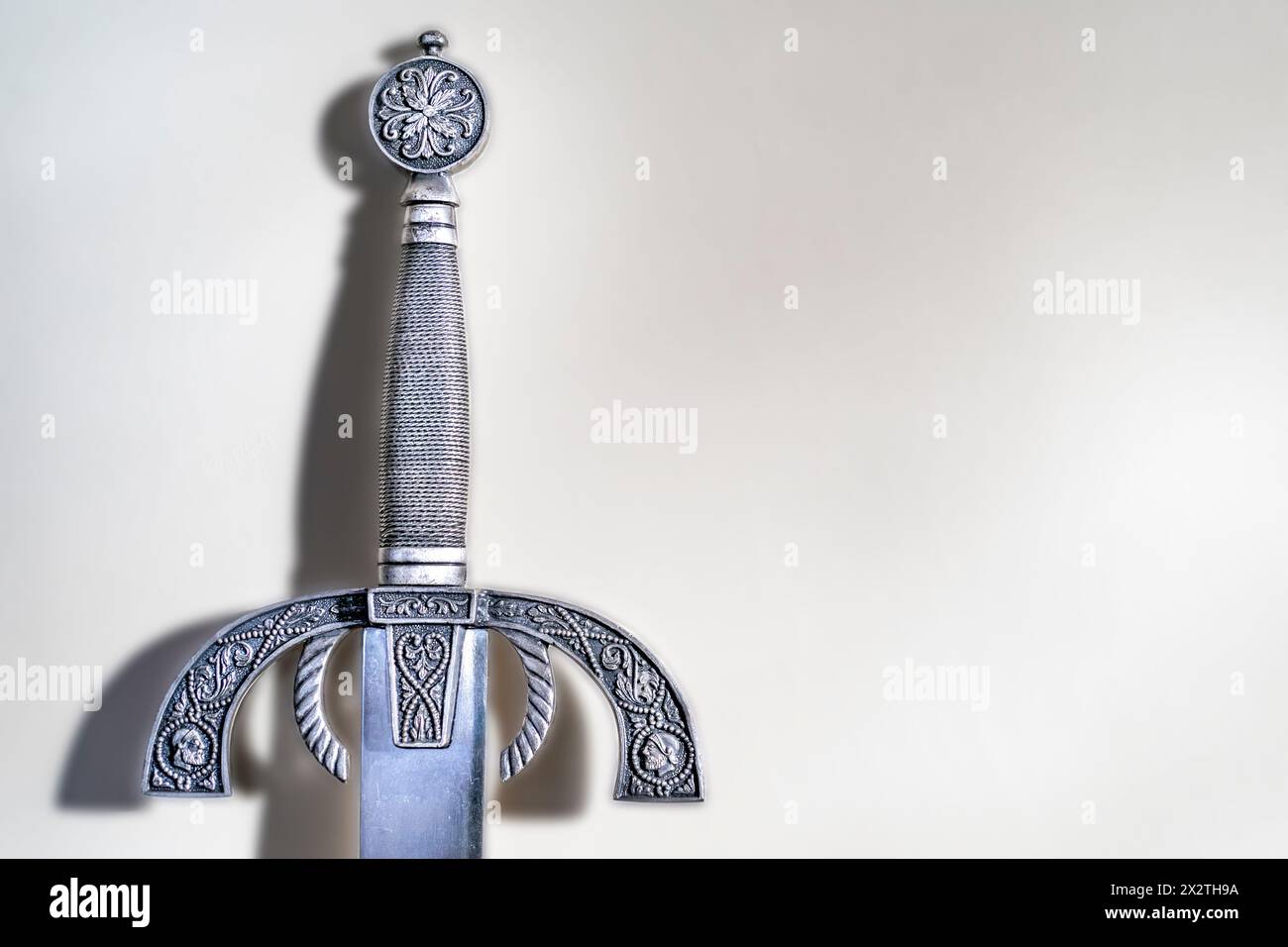 Ornate sword hilt with light background Stock Photo - Alamy