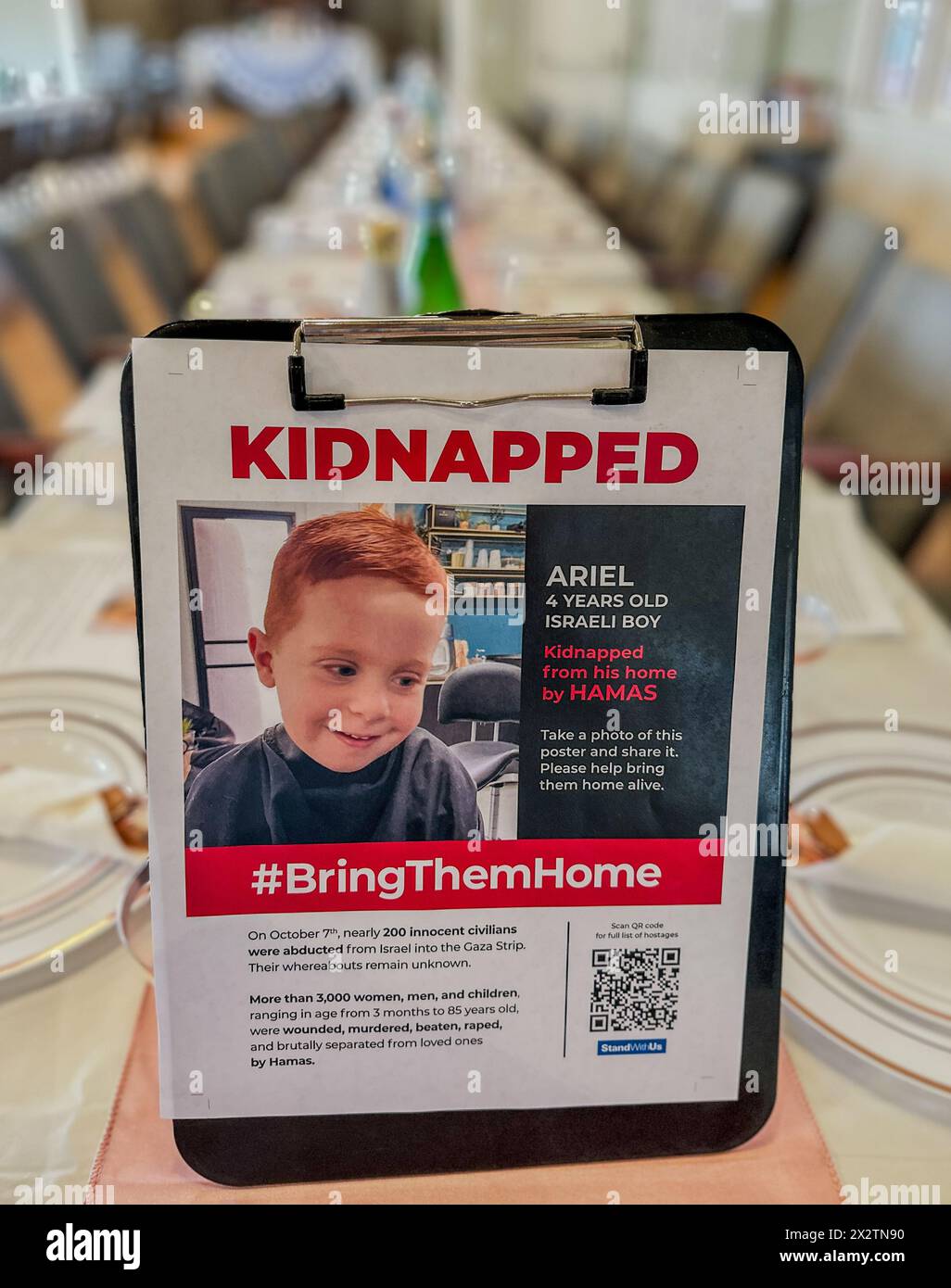 Montecito, California, U.S.A. 23rd Apr, 2024. A 'Kidnapped'' poster of Ariel, a four year old toddler kidnapped by Hamas, on a Passover table in Montecito, California. This is hours before Jews will gather to celebrate Pesach ''” a ritual dinner where the story of how their ancestors in ancient times made the exodus from slavery in Egypt to freedom in Israel. (Credit Image: © Amy Katz/ZUMA Press Wire) EDITORIAL USAGE ONLY! Not for Commercial USAGE! Stock Photo