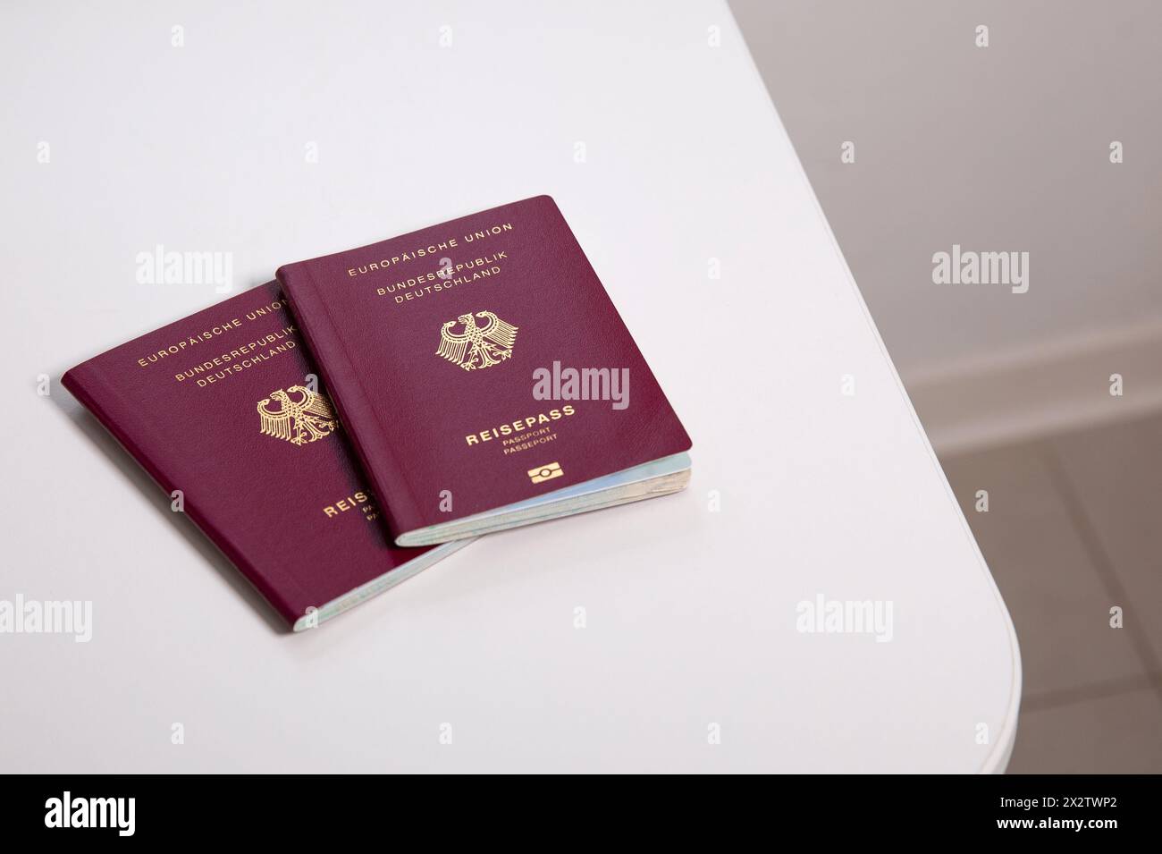 Top view close up of two German passport on white table Stock Photo - Alamy