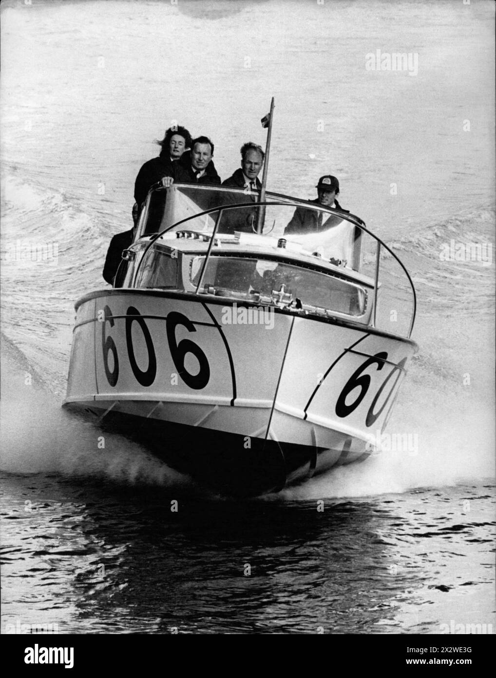 April 4, 1969, London, England: Ford powerboat team L-R: LADY AITKEN, DEREK MORRIS, PETER TWISS and JOHN FREEMAN aboard 606 the 'Seaspray' speeding down the Thames River. Ford's Aim For Powerboat Honors Ford has formed an offshore powerboat team. It will compose four Fairey Huntsman twin turbo-charged diesel power-boats, and their main target will be the Daily Telegraph BP Round Britain power boat race starting on July 26th from Portsmouth. One will be skippered by Lady Aitken, wife of Sir Aitken, chairman of the Beaverbrook Newspapers, and another one will be skippered by Peter Twiss, a forme Stock Photo