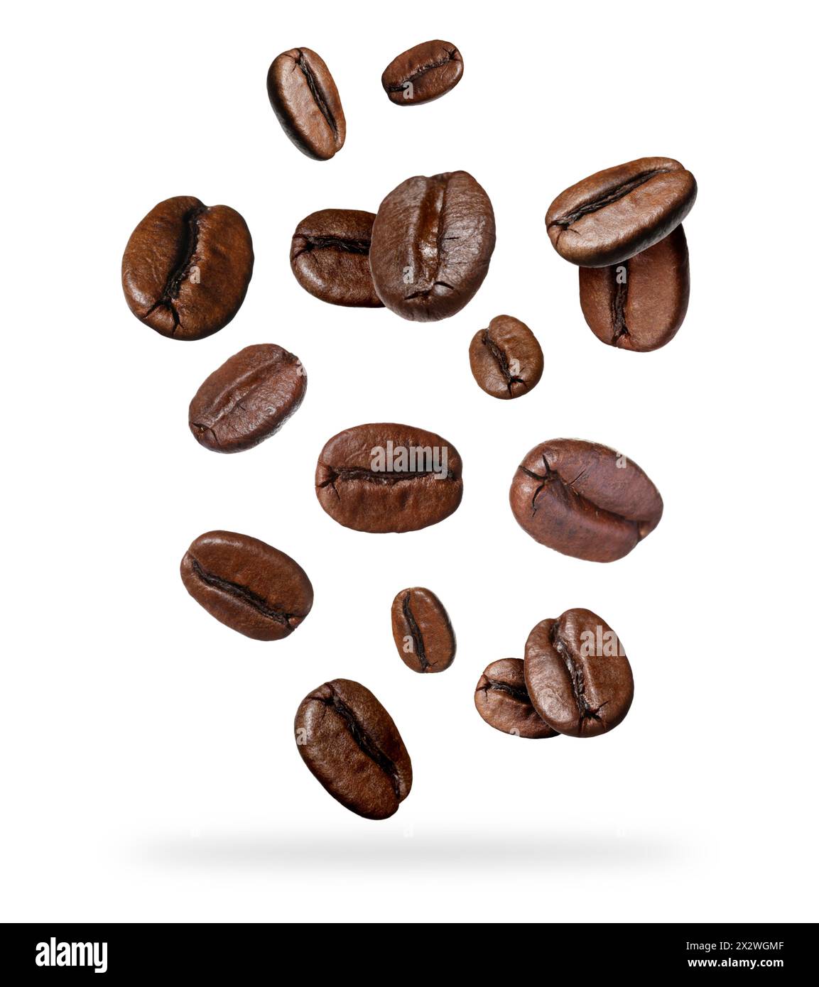 Roasted coffee beans falling on white background Stock Photo - Alamy